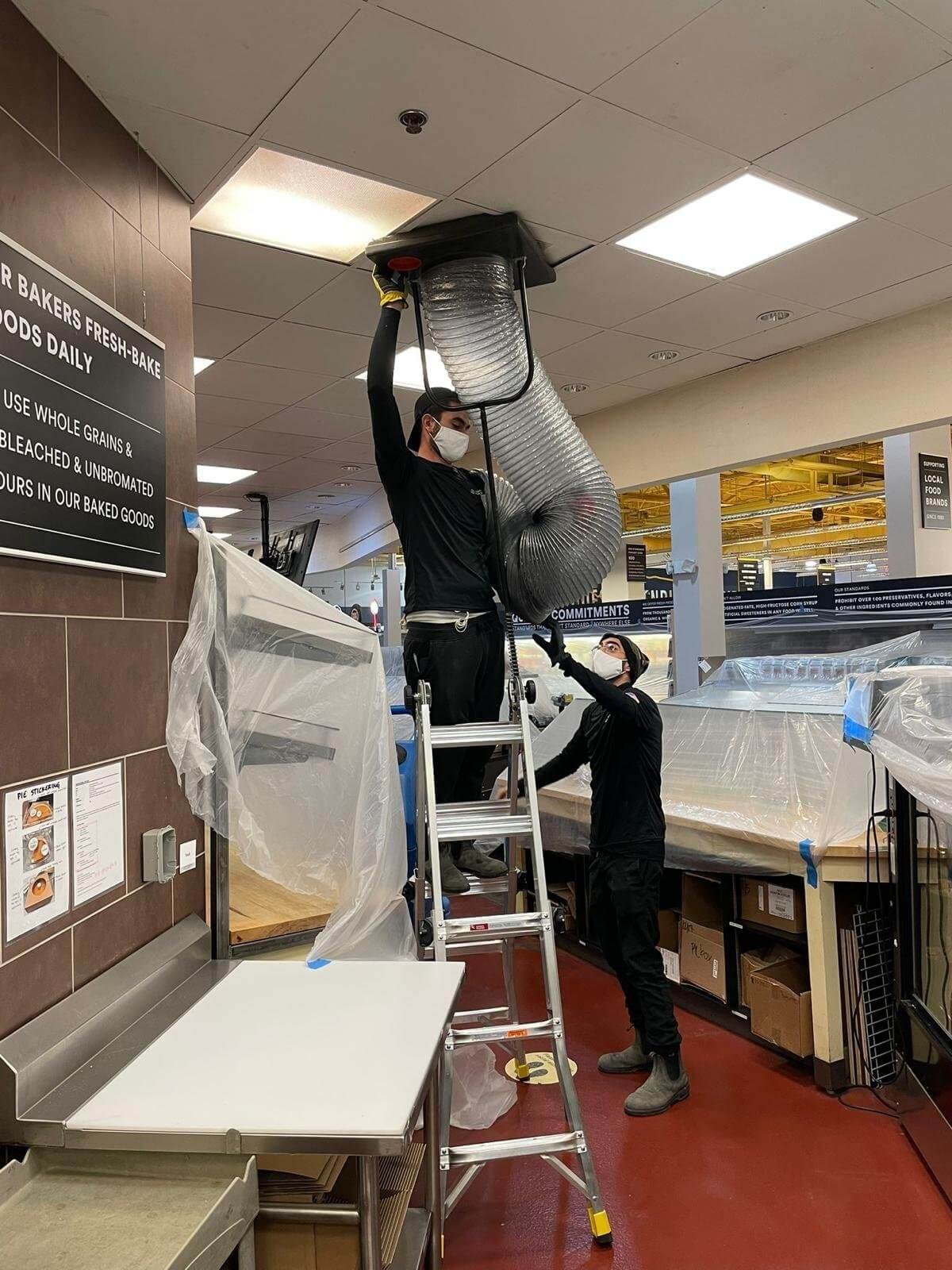united home services tech cleaning air ducts 1 1 (1)